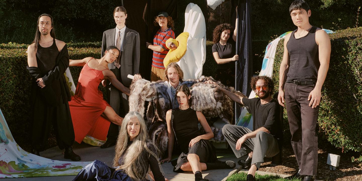 A group of dance performance pose outside for a photo.