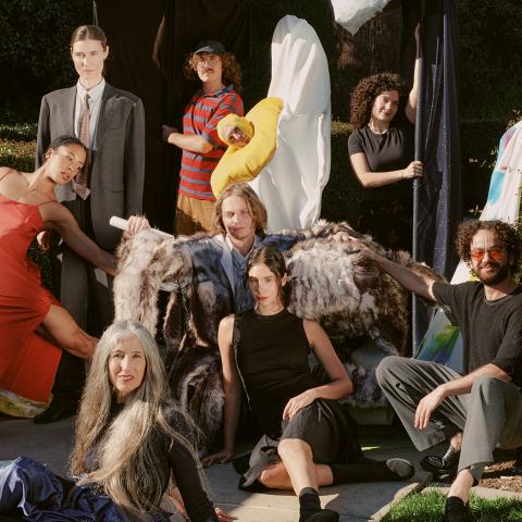 A group of dance performance pose outside for a photo.