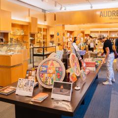 Shoppers look through items at Audrey's Museum Store